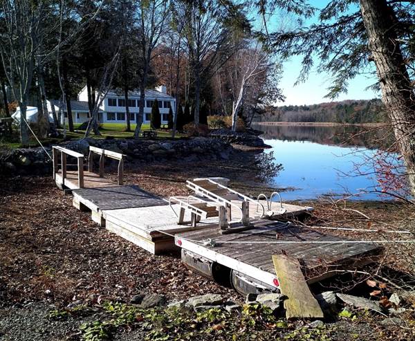 A dock on the shore of a lake

Description automatically generated